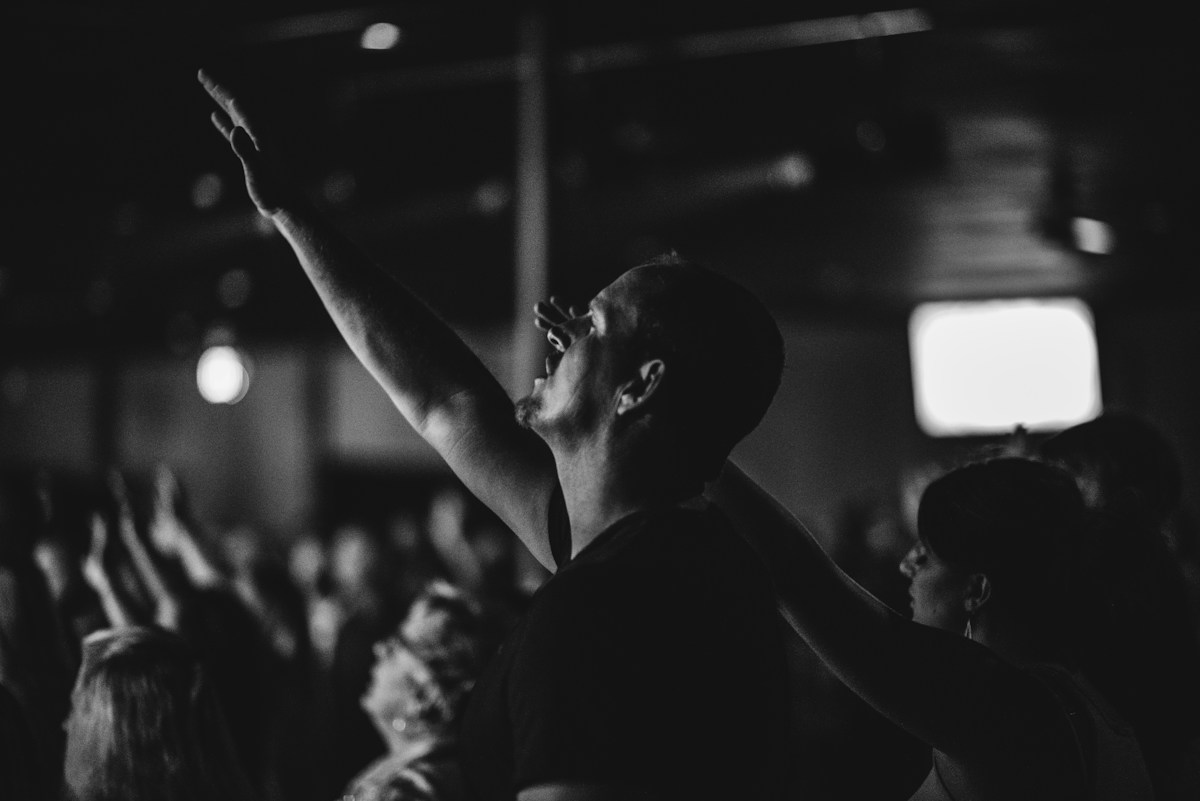 Congregation worshiping with raised hands